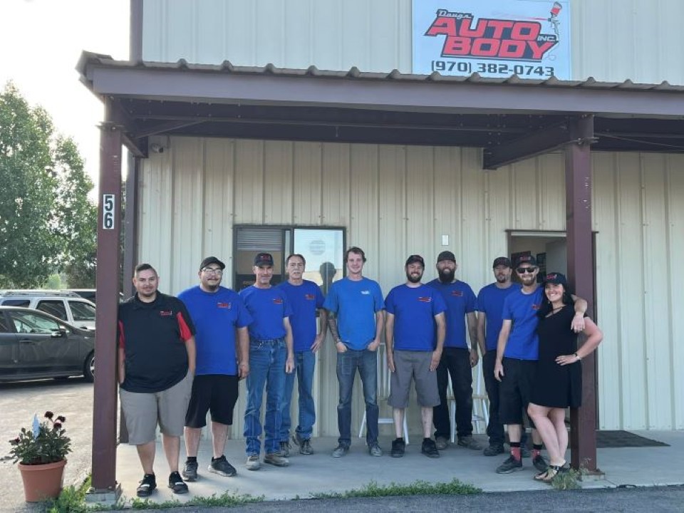 The Doug's Auto Body crew in front of the shop on Davidson Creek Rd